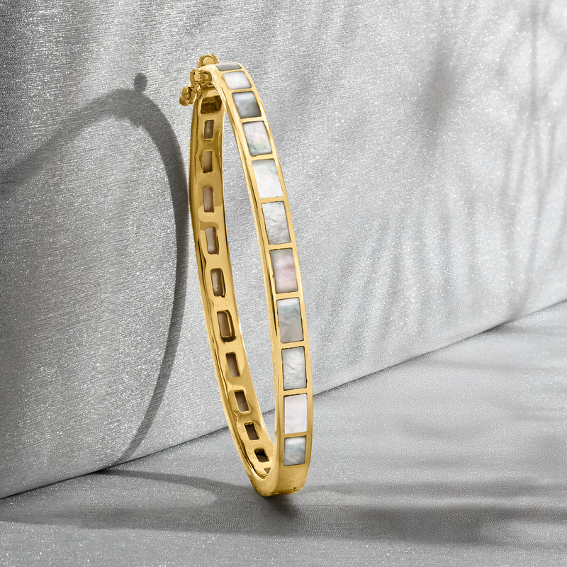 Gold bangle bracelet with mother-of-pearl square links, side view, hinged clasp
