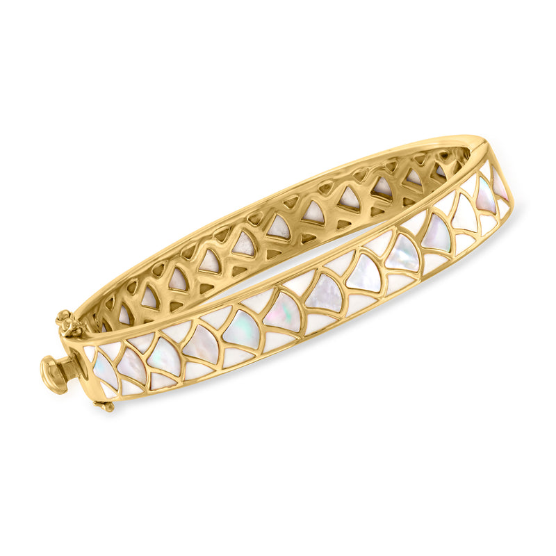 Gold bangle with mother-of-pearl and white enamel lattice cutouts.