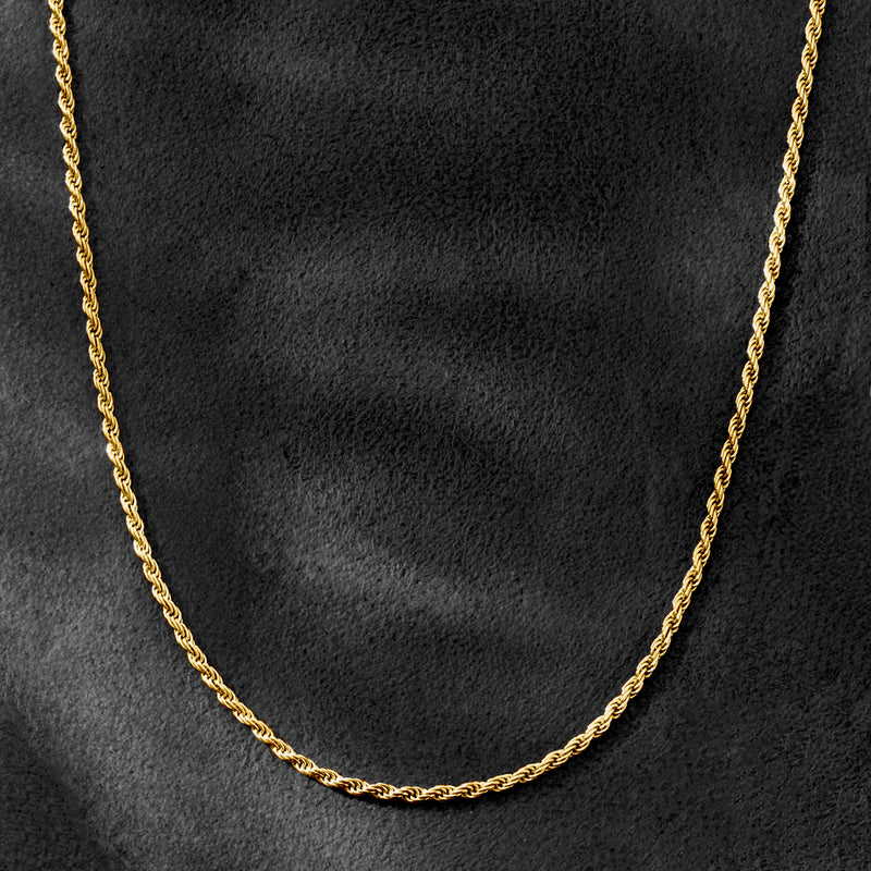 Gold rope-chain necklace close-up showing twisted braided links