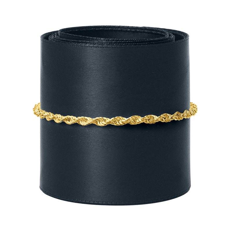 Gold rope-chain bracelet on a black display roll, twisted link texture