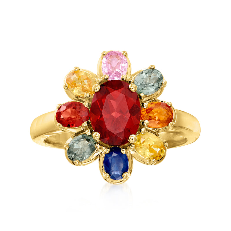 Gold-tone ring with red garnet center and multicolored sapphire stones