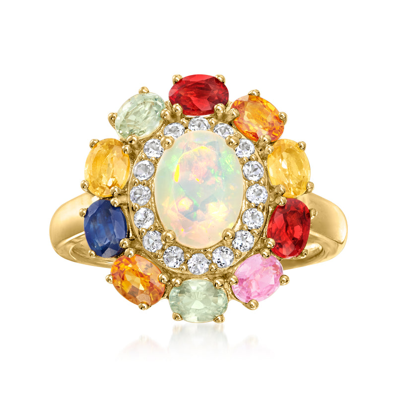 Gold multi-gemstone ring with oval Ethiopian opal centerpiece and red, blue, orange side stones