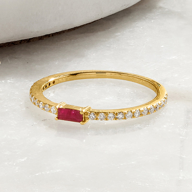 Yellow gold ruby and diamond ring with a baguette ruby and diamond band