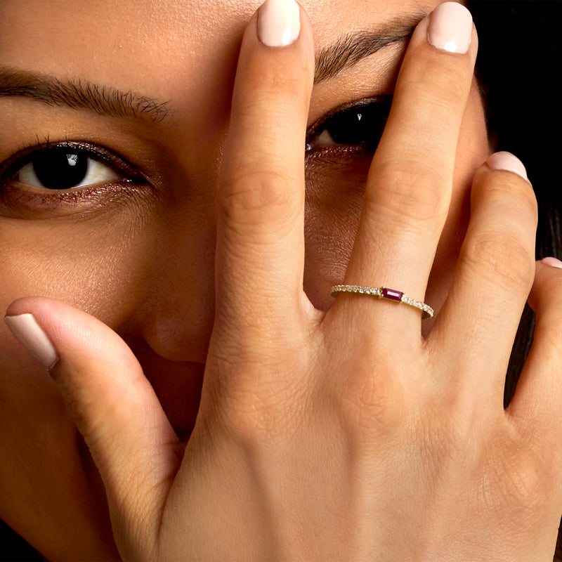 Ruby and diamond ring on hand, 14kt yellow gold band with square ruby center