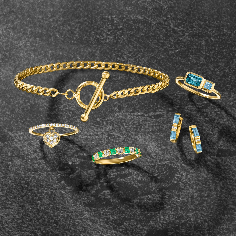 14kt yellow gold ring with emerald-cut green stones and baguette diamonds