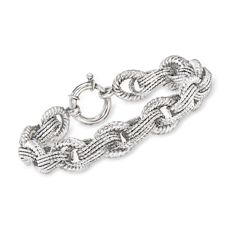 Sterling silver interlocking oval link bracelet with toggle clasp, braided link pattern.