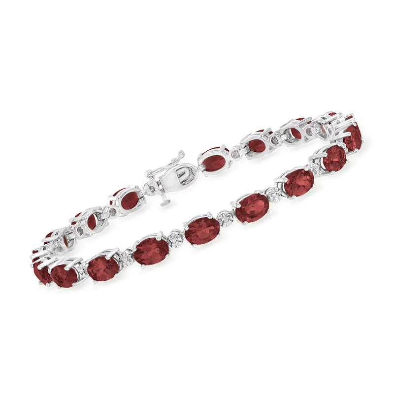 Sterling silver tennis bracelet with round red garnet stones and clear diamond accents
