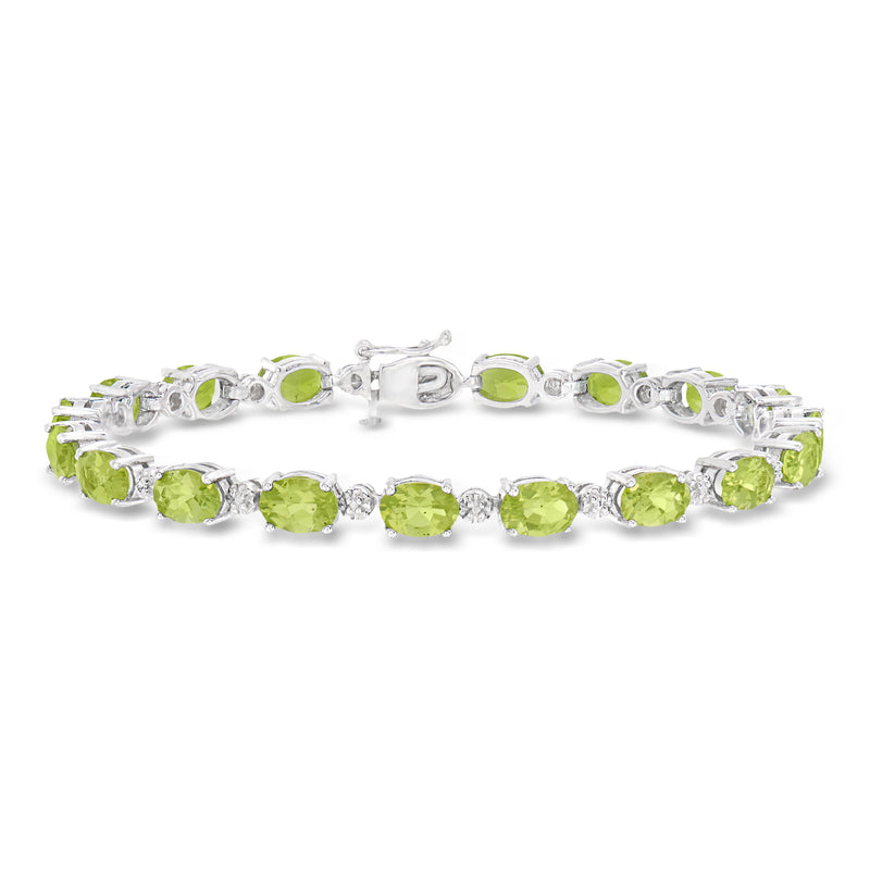 Sterling silver tennis bracelet with oval peridot stones and diamond accents, clasp