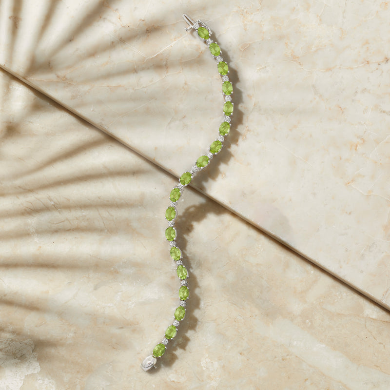 Sterling silver bracelet with channel-set peridot stones and small diamond accents