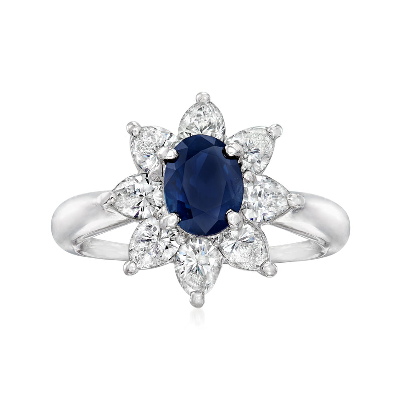 Platinum ring with oval deep-blue sapphire center and six prong-set diamond accents