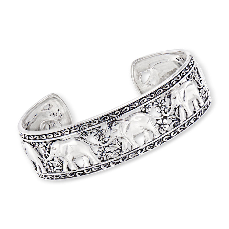Sterling silver elephant cuff bracelet with raised elephant figures and floral etching