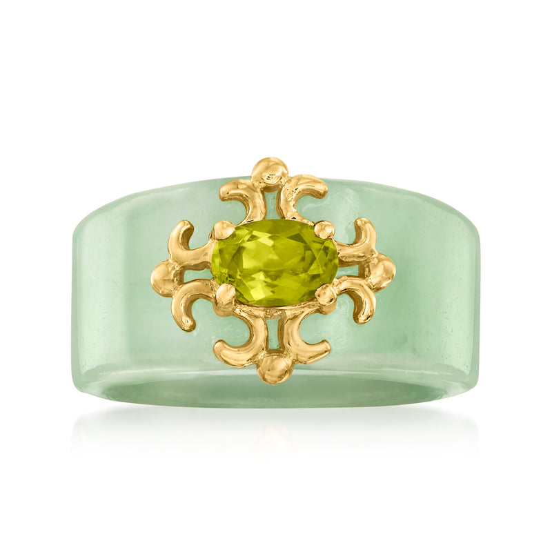 Gold over sterling ring with oval peridot green gemstone and ornate cross-like setting