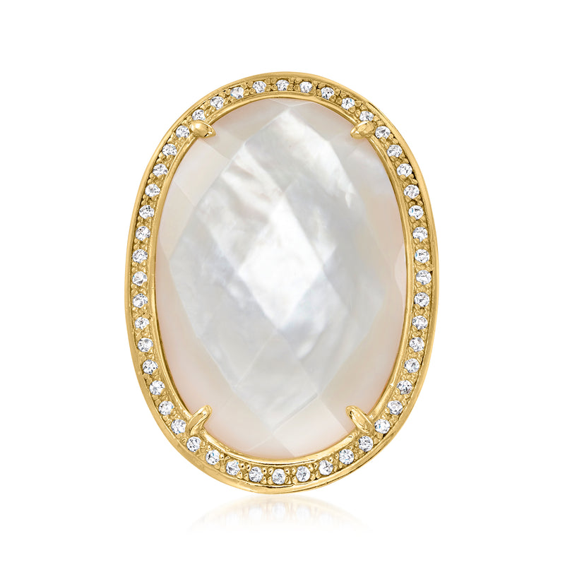 Oval mother-of-pearl ring with white stone halo in gold-tone setting