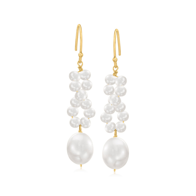 Gold earwire drop earrings with clustered white pearls and one large white pearl.