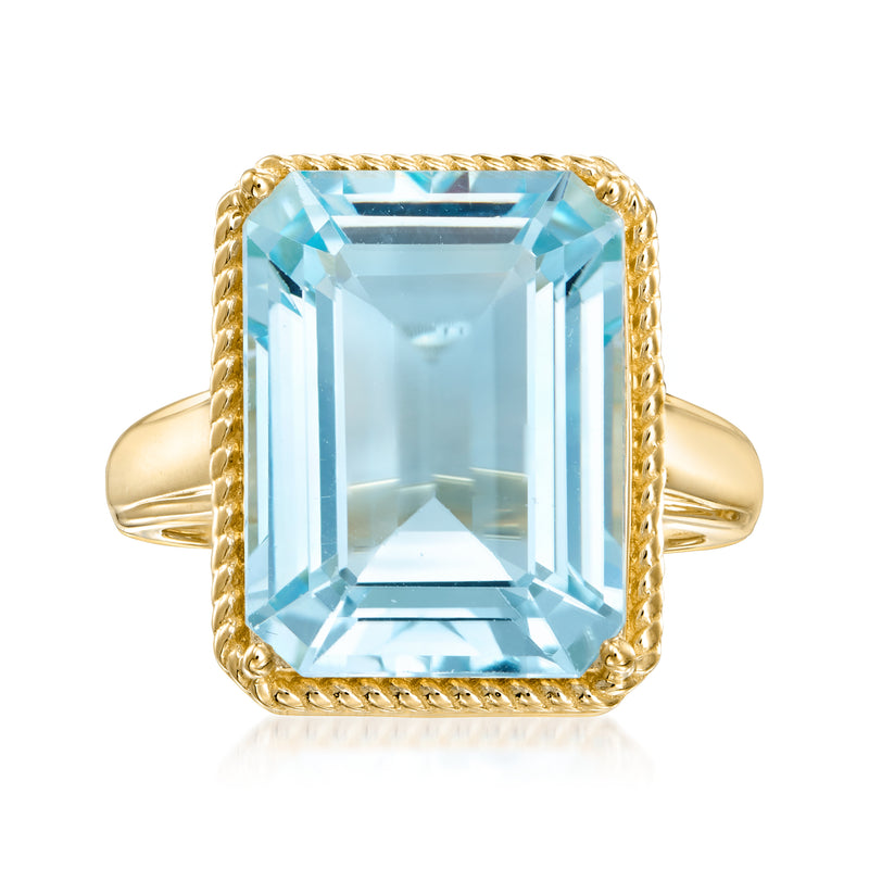 Gold-tone ring with large sky-blue emerald-cut topaz and raised bezel frame