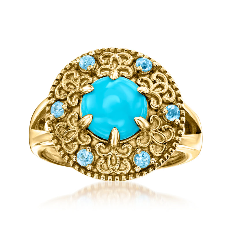 Gold over sterling ring with large oval blue topaz center and ornate blue stone halo