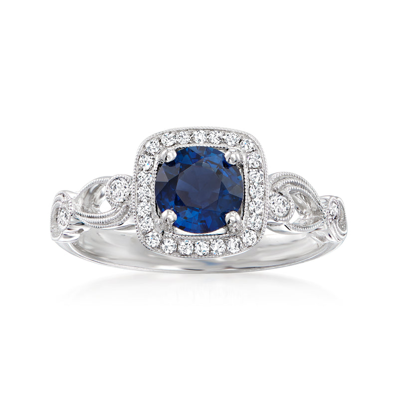 Sapphire and diamond halo ring in 18kt white gold, blue oval center stone