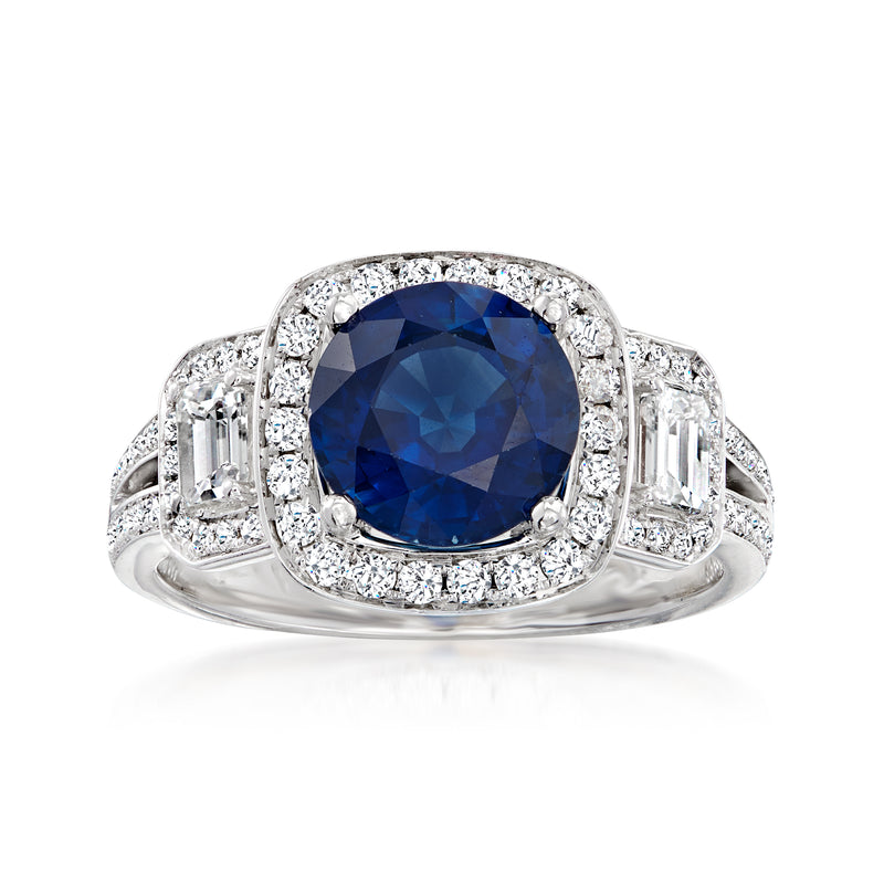 White gold diamond halo ring with oval blue sapphire and baguette accents
