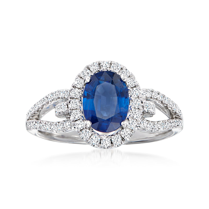 Blue oval sapphire ring with diamond halo and prong-set white gold band