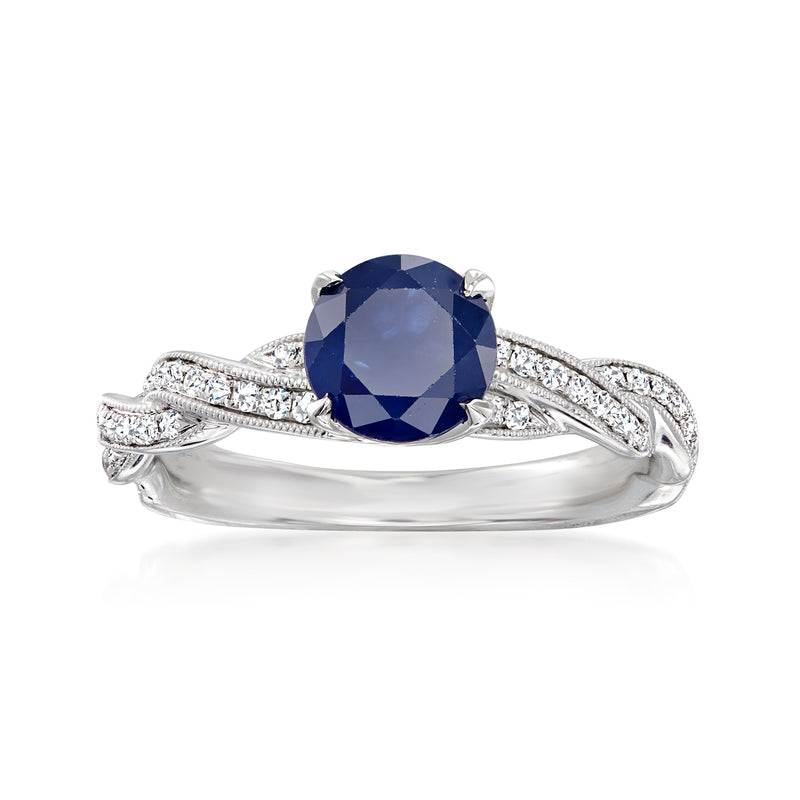18kt white gold ring with cushion-cut blue sapphire and diamond side stones
