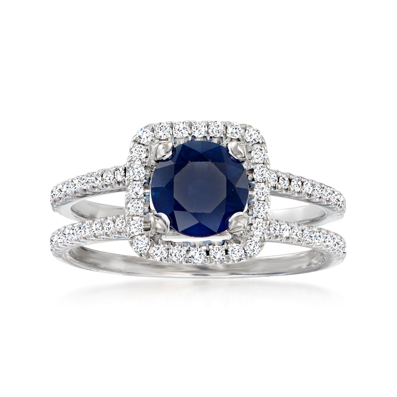 18k white gold halo ring with dark blue sapphire center and diamond accents