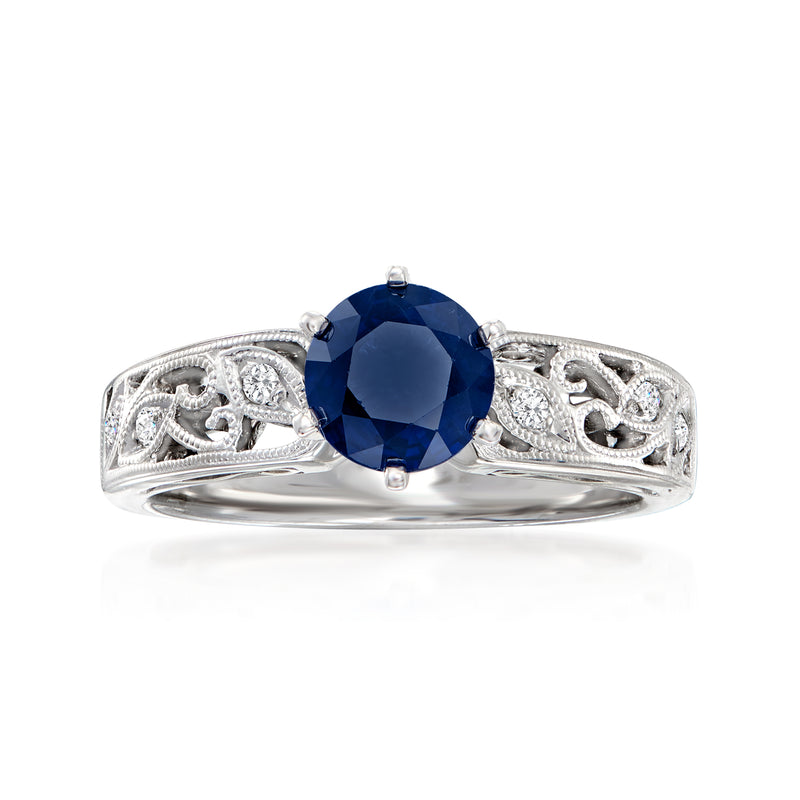 18kt white gold sapphire ring with blue center stone and diamond accents, detailed band