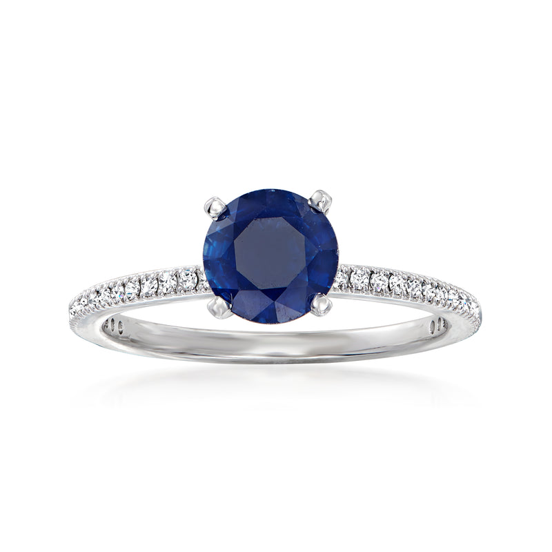 18kt white gold ring with round sapphire and pavé diamond band