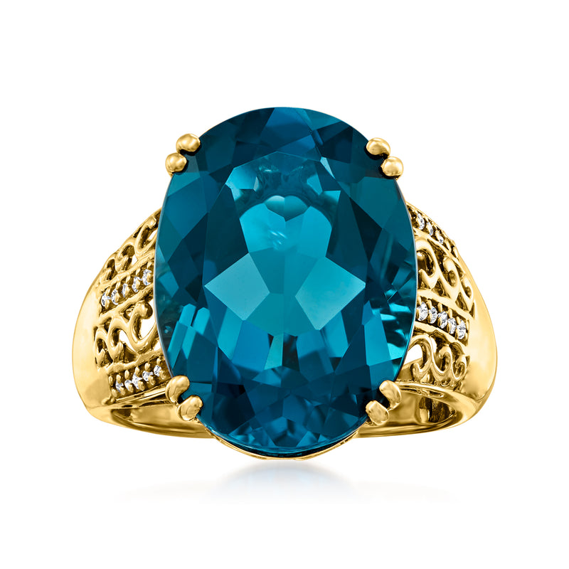 Oval London blue topaz ring in 14kt yellow gold with diamond accents on shoulders