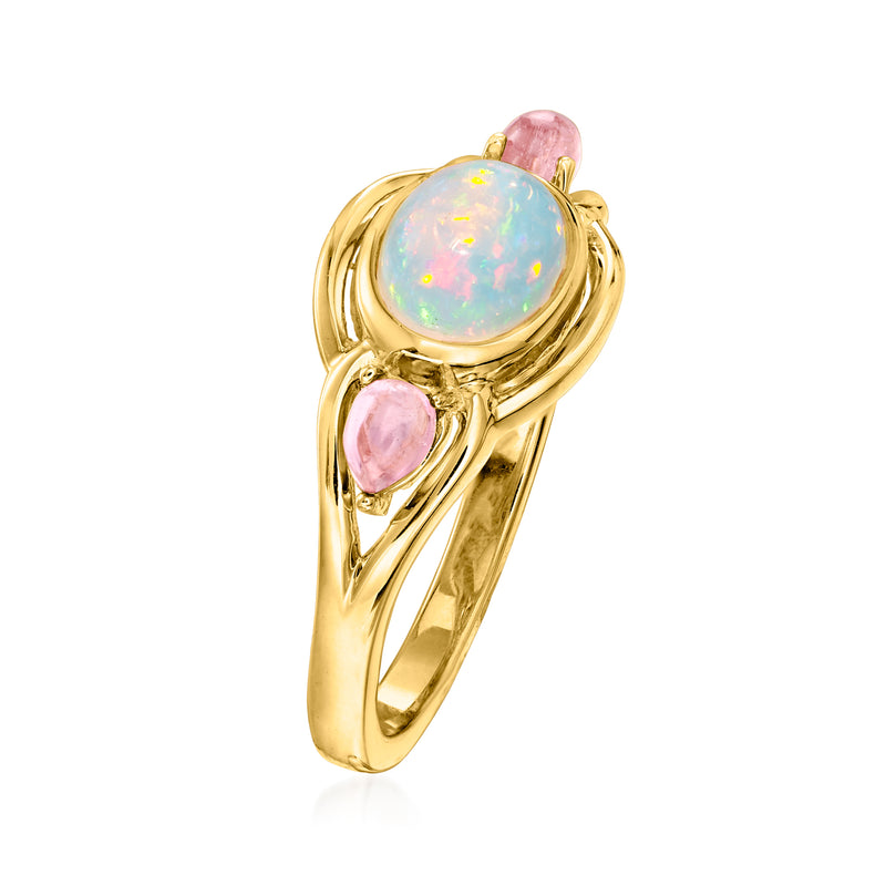 Gold over sterling ring featuring round opal center with two pink stones