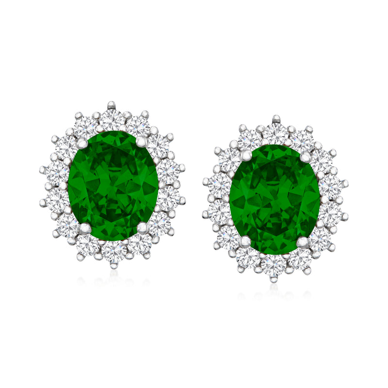 Sterling silver post earrings with green oval simulated emerald CZ halo