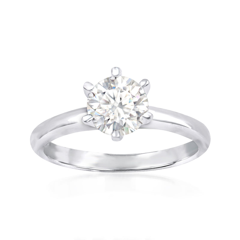 Sterling silver ring with round moissanite center stone in four-prong setting