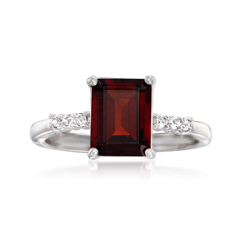 Sterling silver ring with rectangular garnet center and white topaz side stones