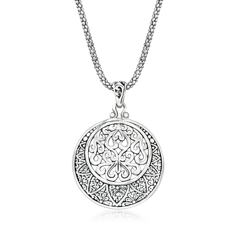 Sterling silver circle pendant necklace with openwork filigree floral center