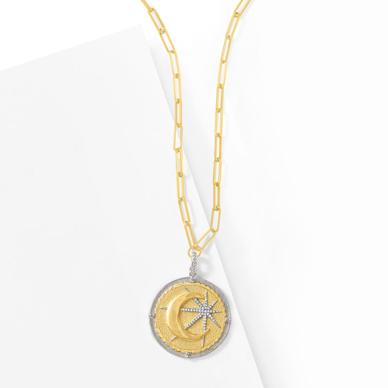 Two-tone sterling silver moon and star pendant necklace with round gold-tone center