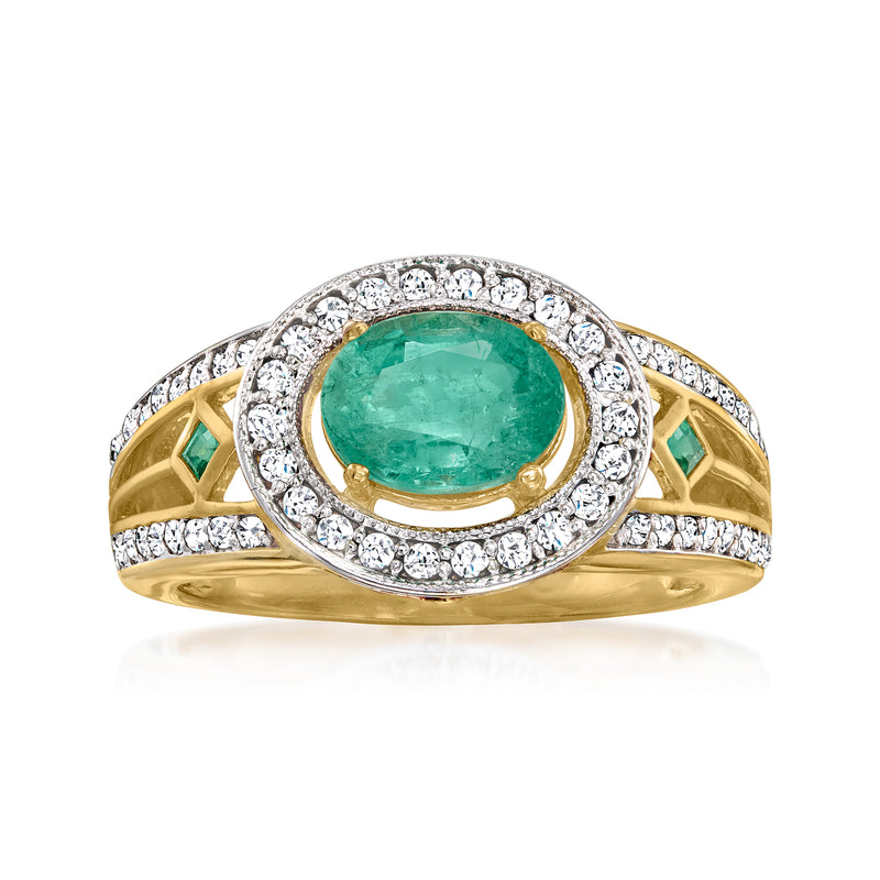 14k yellow gold ring with oval emerald center, diamond halo, green emerald accents