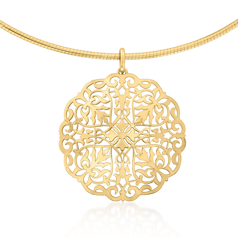 Round yellow gold filigree medallion pendant hanging from a thin chain