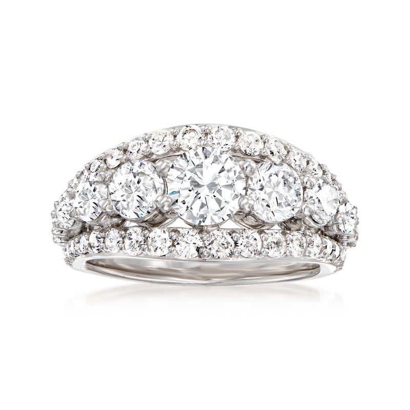 White gold diamond multi-row ring with round stones on a curved band.