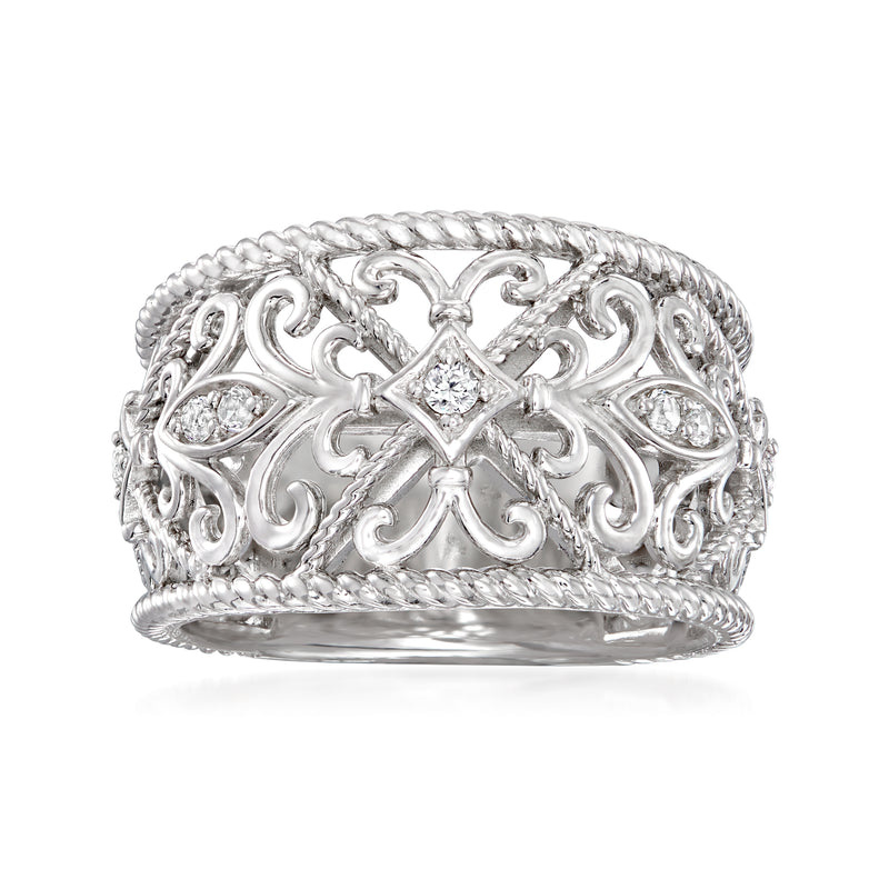 Sterling silver filigree ring with oval top and small white gemstone accents