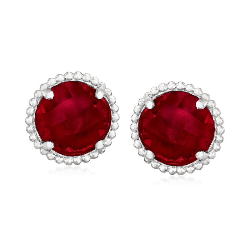 Sterling silver garnet stud earrings with round red gemstone halo
