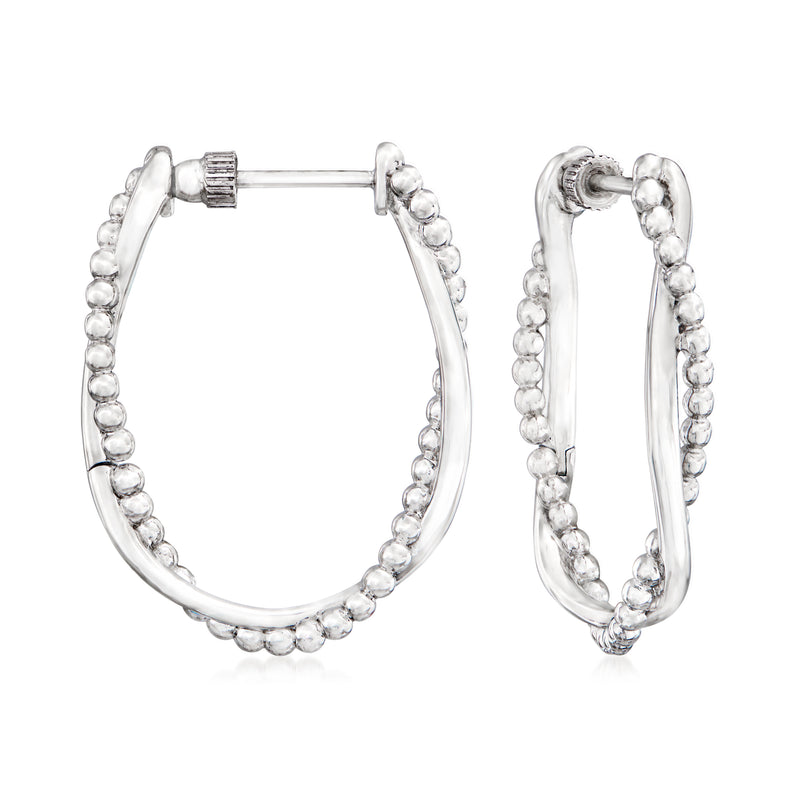 Sterling silver twisted oval hoop earrings with small bead-like texture along the edge