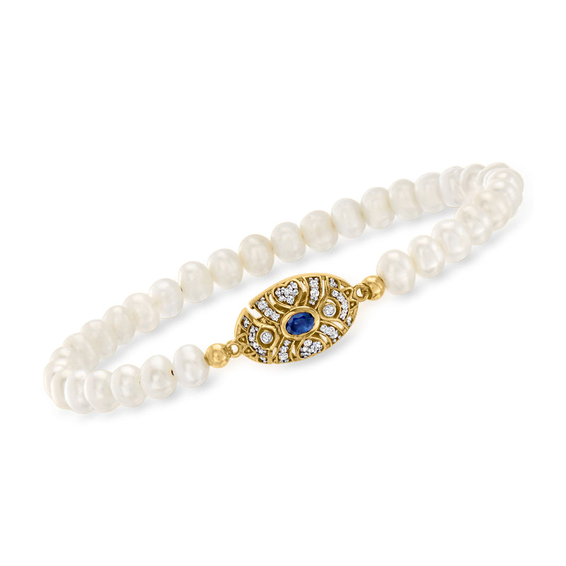 Cultured pearl bracelet with gold links, oval sapphire center and diamond accents
