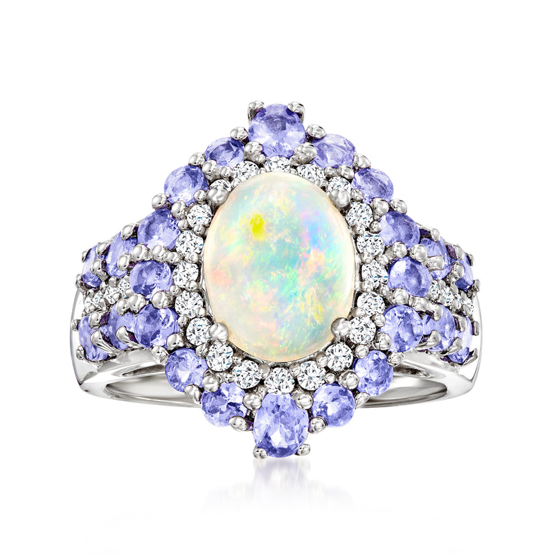 Sterling silver ring with oval opal center, blue oval gemstones, and white zircon halo