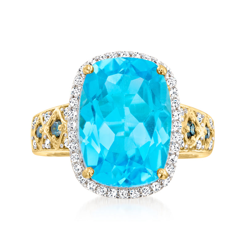 Oval Swiss blue topaz ring with diamond halo and blue accents on 14kt yellow gold band
