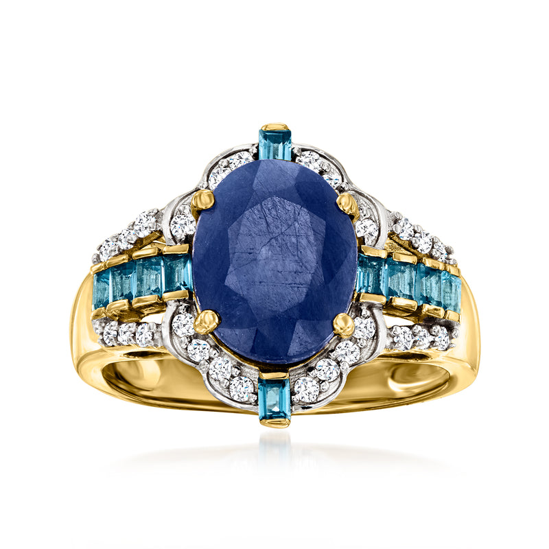 14kt yellow gold ring with oval blue sapphire center, blue topaz sides, diamond halo