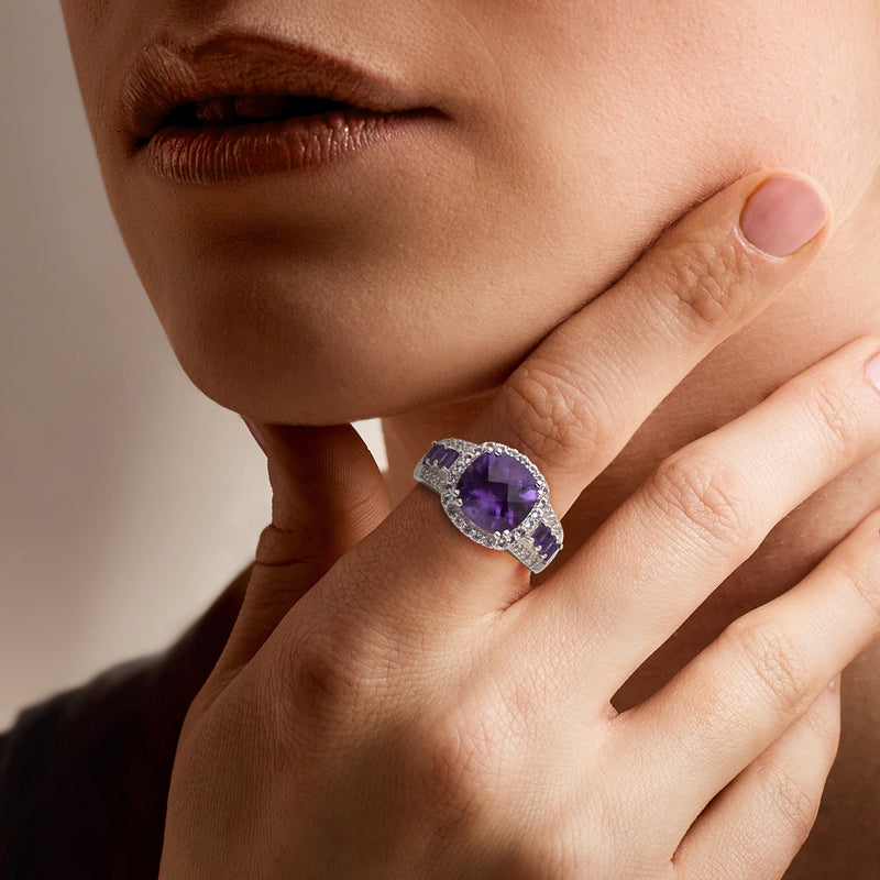 Sterling silver amethyst ring with diamond-set oval band, worn on hand