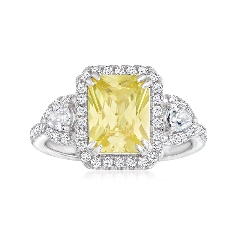 Sterling silver ring with large yellow CZ center and white CZ halo, surrounded by side stones