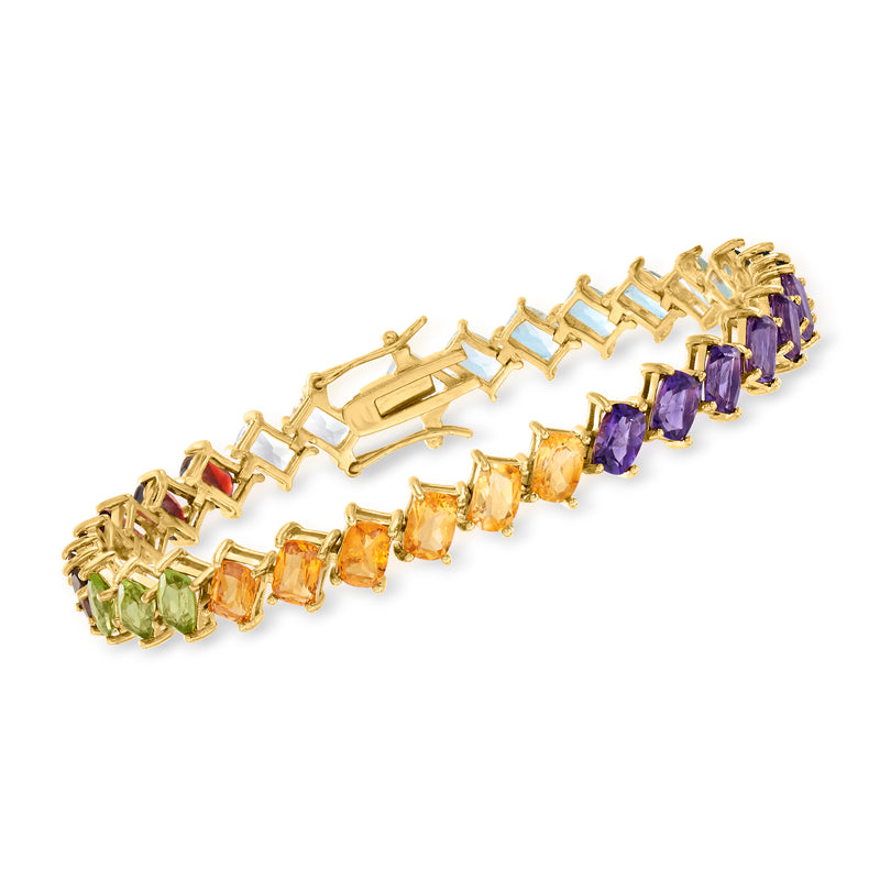 Gold-tone multi-gemstone tennis bracelet with purple, orange, green, and red stones