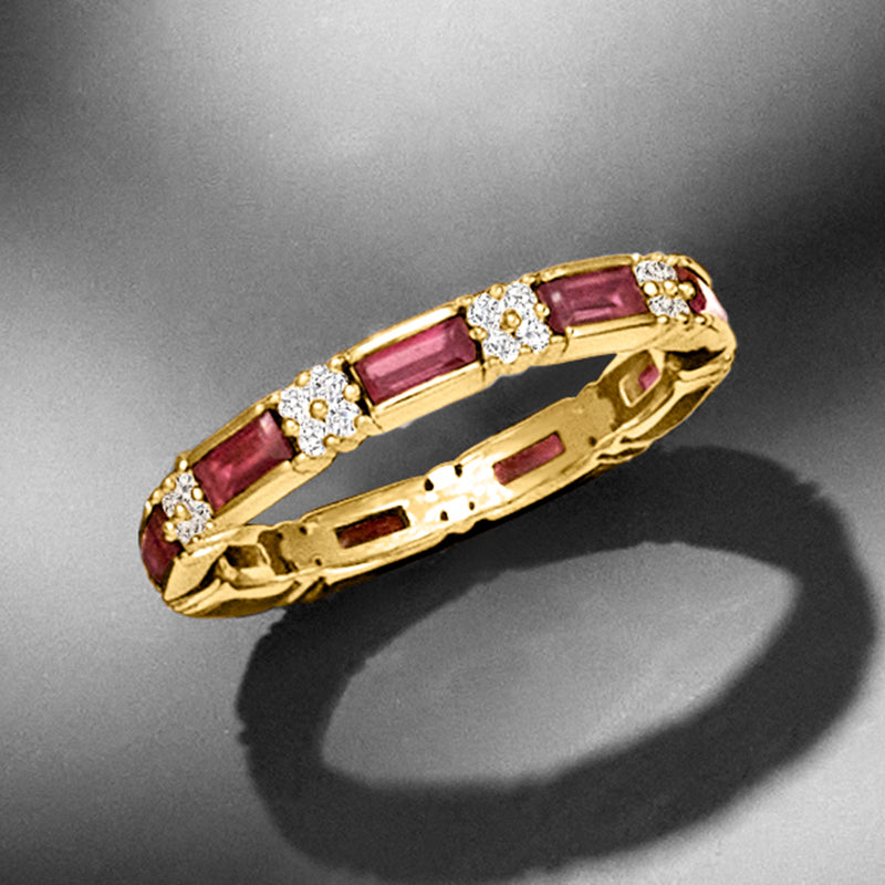 Gold eternity band ring with alternating pink rectangles and white round stones, angled view