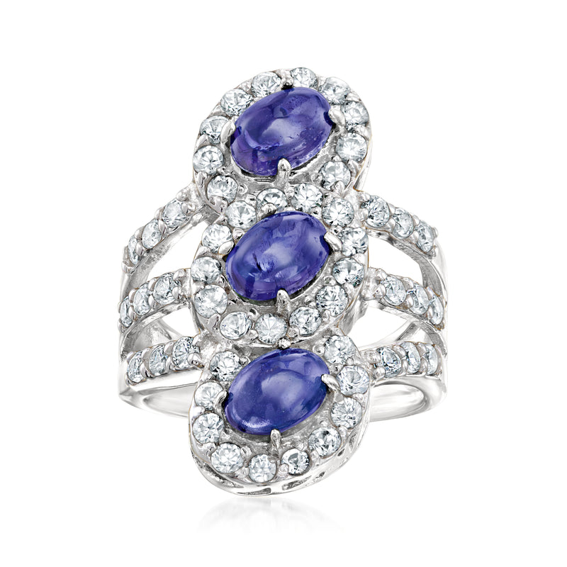 Sterling silver ring with three oval tanzanite-style blue stones and clear halo accents