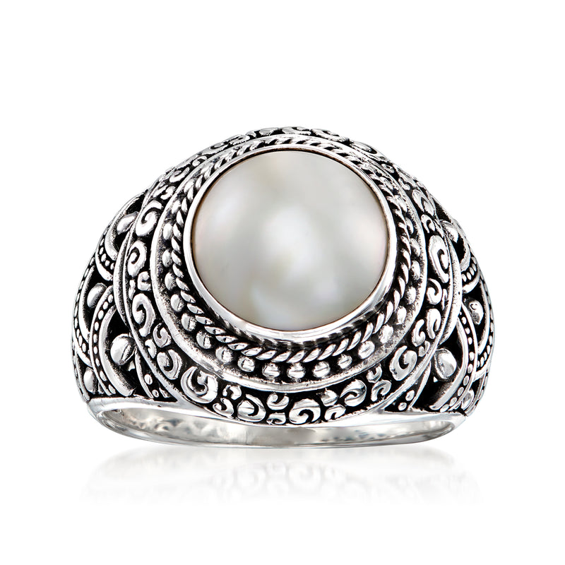 Sterling silver bali-style ring with oval white mabe pearl and ornate engraved band